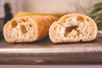 A loaf of bread cut open to show the crumb