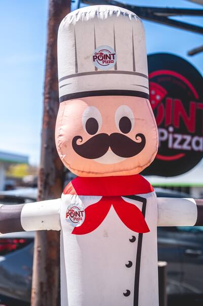 A close look at the inflatable chef with a red neckerchief