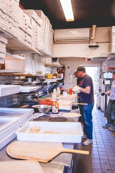 A cook working at the prep counter in the kitchen